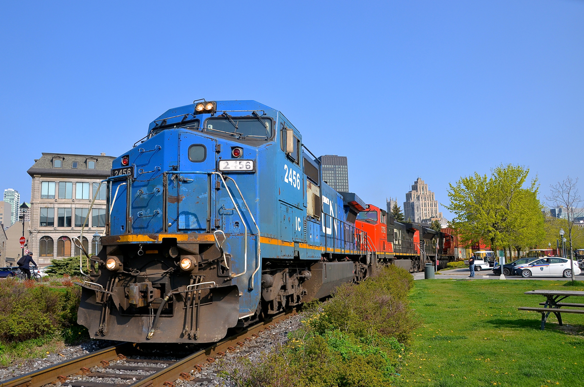 Traces of Conrail. The only units left on Class I's that are still in Conrail blue plaint since Conrail days are the ex-LMSX IC Dash8-40CW's on CN, which initially were leased units shared by Conrail and CN. While a few have been repainted into CN colours, most solider on in rather faded Conrail blue. Here IC 2456 (ex-LMSX 729) leads an IC unit in CN paint (IC 2705) and CN 8851 as CN 149 slowly leaves the Port of Montreal on a gorgeous morning.
