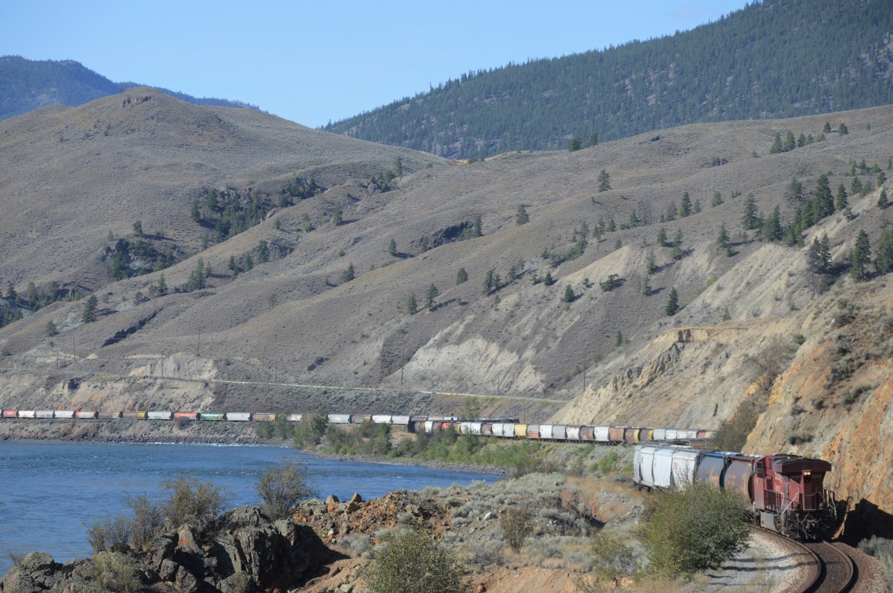 CP 9365 moves grain loads along the Thompson River at Martel on CN's Ashcroft Sub on a beautiful August morning.