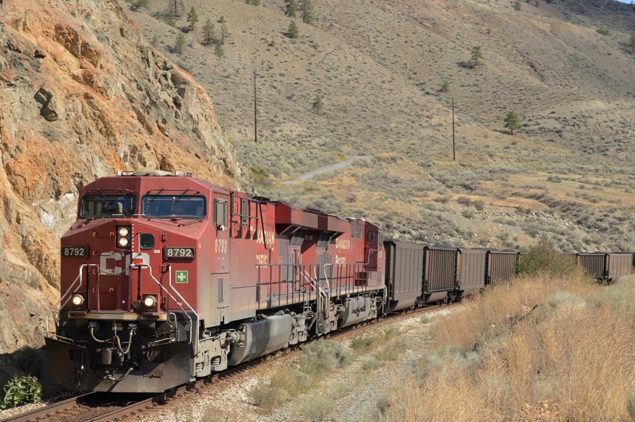 A heavy CP coal train rolls along CNès Ashcroft Sub on a hot August day along the Thompson River.