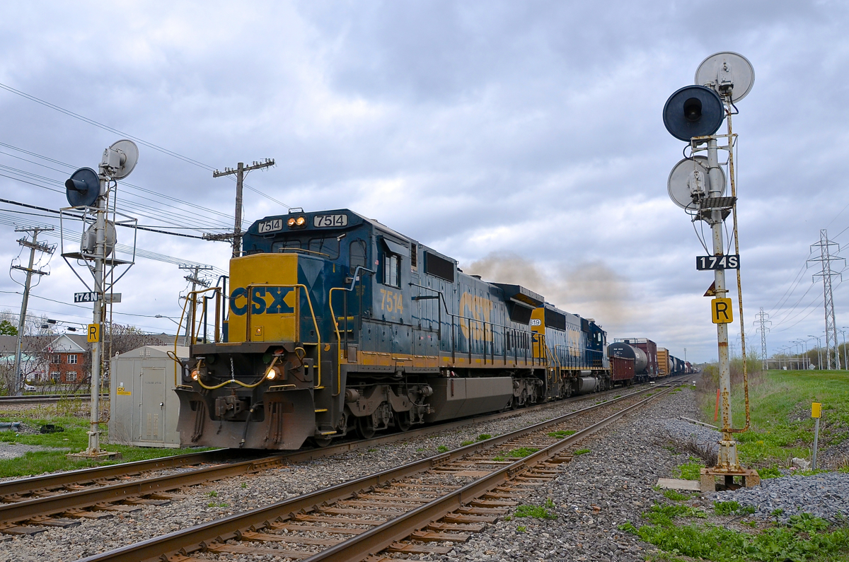 A pair of standard cabs splitting the signals. CN 327 has a pair of veteran standard cab units (C40-8 CSXT 7514 & SD50-2 CSXT 8619) as it splits the signals just past the HBD at MP 17.5 of CN's Kingston sub.