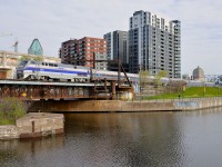 <b>Another morning, another heritage unit</b> A day after heritage unit <a href=http://www.railpictures.ca/?attachment_id=24696>AMTK 822</a> led the <i>Adirondack</i> in Montreal, another heritage unit performed the honours this morning. Here AMTK 184 is pushing the <i>Adirondack</i> past Wellington Tower.