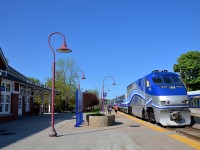 <b>Stripes still not lined up.</b> The stripes on AMT 1322 are still not lined up properly as it leads AMT 72 from Candiac past Montreal West station.