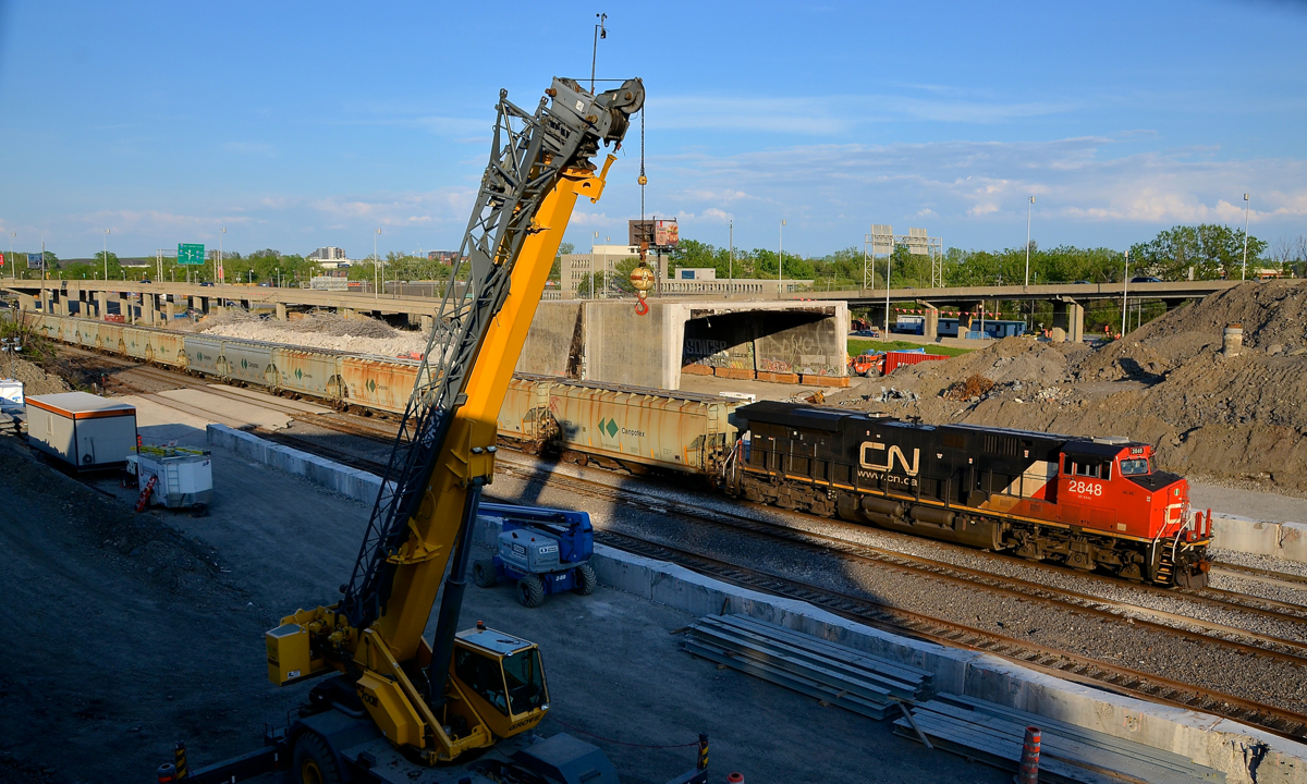Past where the tunnel used to be. The DPU on potash train CN B730 (CN 2848) is passing the site of a tunnel on CN's Montreal sub that was removed about a week ago. Part of the tunnel is still visible behind the train, as it was lifted off the tracks in pieces over a few weeks.