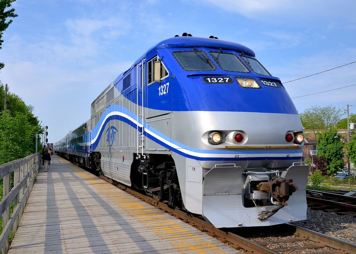 First stop on the island. AMT 86 has just arrived on the island of Montreal from the South Shore as it makes its stop at Lasalle Station, led by F59PHI AMT 1327.
