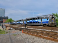 <b>Leaving downtown Montreal.</b> Cab car AMT 3023 leads AMT 25 as it leaves Lucien L'Allier station in downtown Montreal. 