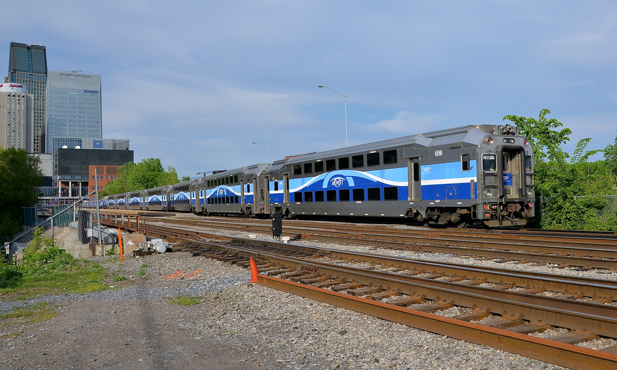 Leaving downtown Montreal. Cab car AMT 3023 leads AMT 25 as it leaves Lucien L'Allier station in downtown Montreal.
