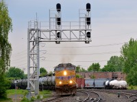 UP 5422 leads loaded oil train CP 550 around a curve as it approaches Lasalle station, with the small Lasalle yard at right. DPU on this train is another UP unit - UP 5504.