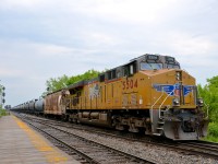 UP 5504 brings up the rear of loaded oil train CP 550 as it passes the platform at Lasalle station. Up front was another UP unit - UP 5422.