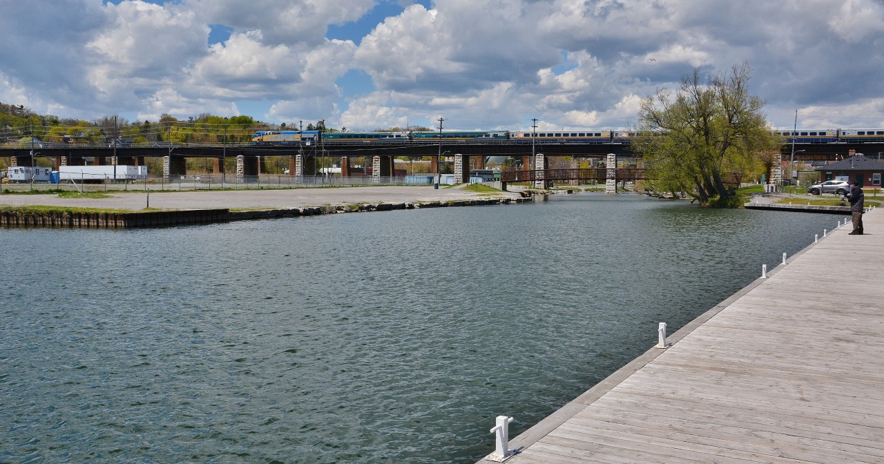 A lone fisherman works the Ganaraska channel as VIA 45 ( VIA 918 west ) rumbles by 


May 17, 2016 digital by S.Danko 


What's interesting: the original CN 918: 



    CN 918   




sdfourty.