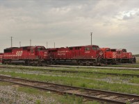 CP 8926 an ES44AC is surrounded by GM power, flanked by SOO SD60 6053 to the left and stored SD40-2's to the right. 