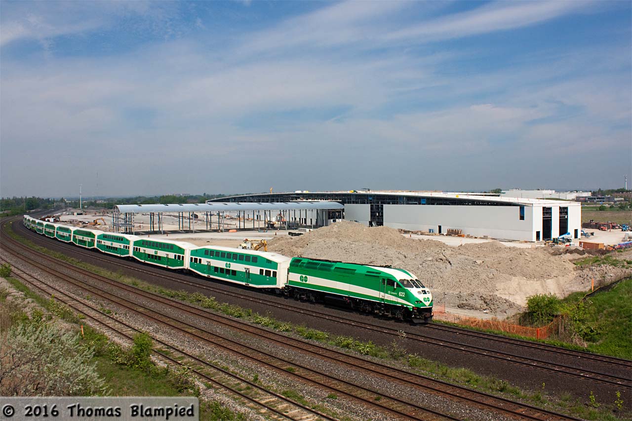 A photograph where the background is more important than the foreground. As GO 622 pushes 913 towards the station in Whitby, we see the latest progress on the new GO East Rail Maintenance Facility. The main maintenance building has been covered in cladding and the outdoor storage tracks have received their canopy. Although not visible in this shot, a sizeable amount of rail has been delivered to the west end of the site too. Behind the photographer, two smaller buildings are being built on the east side of Hopkins Street. The new traffic lights at Victoria and South Blair are now working and all the line painting on the road is complete, so it may only be a matter of days before South Blair reopens. As for Hopkins Street, there are no signs of its impending closure, but no signs of it staying open either.