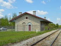The 1858 limestone depot of the GTR still stands along the former Thorndale Sub at the location once known at St. Mary's Jct; where the Thorndale Sub continued southwest to London, and the Forest Sub began towards Sarnia.  Just out of frame at left is GTW caboose 79176, built in 1957.