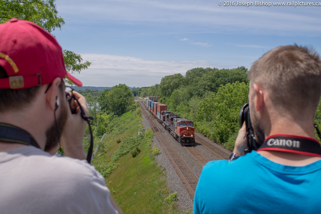 Every year on the third Saturday of June, the annual CNR Bayview Meet is held on the Laking Gardens pedestrian bridge at the well known CN Bayview Junction.  Railfans come from all over Ontario to meet up and watch trains on this day.  For me it is not a day to take the money shot or go off chasing an excellent train, it is a time to see some old friends and get to catch up with others.  Pictured is CN 148 framed between two railfans, I am unsure who is on the left but the photographer on the left is my good friend Cody Lee.   This year the meet occurs on June 18, 2016, railfans will be there from daybreak until sunset, hope to see lots of people there!