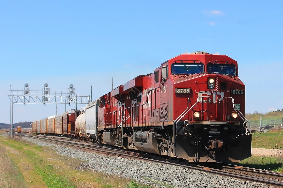 Having left the majority of the train on the yard CP 8785 and 8856 leave heading east with less than 20 cars.