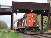 Having worked from Brantford to London 4136 is seen long hood forward as it returns east and passes under Gobles Road bridge. It was see in Princeton heading west on the North track and is returning on the South track. This is the site of mile 40 hot box detector and is to the west of Princeton. 
