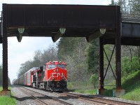  An eastbound mixed freight hauled by two of CN's newer locos 3007 & 3058 passes under Gobles Road bridge. This is the site of mile 40 hot box detector to the west of Princeton.