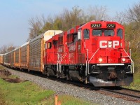 CP 2257 & 2292 race east with a string of autoracks towards Wolverton and onwards. Seen at Gobles RD.