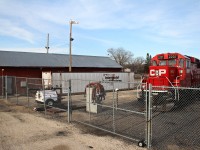 The Caged Beast. CP GP20EC0-C 2207 sits locked up in Portage La Prairie Manitoba as the lone unit in charge of working the various industries required on a daily basis one that regularly sees a Caboose/riding platform for the long shove to Simplot of a few miles west of the small Manitoba city.