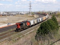 Nothing normal looking about train 517 today.Seen here at Whitby west bound with about 18 two bay hoppers and a cut of double stacks, and then the only way to make a new GE look good, run long hood forward. Not to question why, but just to enjoy. :)