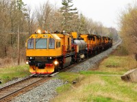 While out and about today, I heard a strange call number on the scanner that wasn't a standard CP number so I figured I should go down for a look. It turns out the RG 319 number belongs to one of the Loram rail grinders making its way westward. 