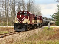 Having completed the switching work at Guelph Junction, the pair of older MLW's in GJR 181 and GJR 505, rock and roll along the bolted rails as they power up and cross side road 10 at MM 18.27, on their way back to Guelph. Had this consist been a little shorter, ex CP caboose 434462 would have been visible on the tail end.