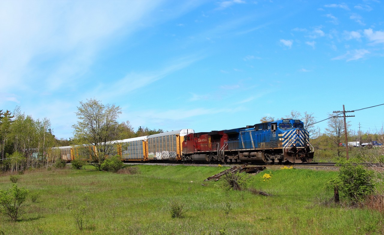 With what started off as a very overcast morning, the clouds were parting just nicely as CEFX 1020 leads CP 8527 up to MM 37 and Canyon Road just outside Campbellville