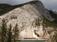 Westbound train 469-12 rolls along Crowsnest Lake in the early afternoon.