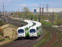 Upon my first photographic railfanning trip to the Oshawa area in seven years, within moments of arrival I was reminded how frequent the trains are and that meets are nothing to jump over. Nonetheless, any CN trains that went by I barely even felt were picture worthy, which is probably one reason I don't bother to go out of my way to go east much. Some relatively decent timing between two GO trains allowed for this shot. In only about a year, this has quickly become the new face of GO Transit. Bombardier hasn't given the TTC the same luck wit their new face unfortunately. The new cabcars are now in the 30 range, and are pretty about as common if not more common than the older cabcars now. From my understanding, and would be my best guess, the older cabcars will be converted to regular coaches.
<br><br>
In the distance lies Oshawa yard, and if you look closely, autoracks can be seen throughout the entire background for the GM plant. The Hopkins Street overpass, which quite possibly has become the most popular railfanning location in Canada in recent times, is now ticking down its final days, and should be closed any day now.