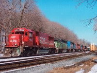 Those of you that have taken up capturing trains in their environment in the past couple of years are probably disappointed that views such as this one are only 5 years old.  How times have changed. We have gone from colourful lashups such as this #246 to today's mostly pairs of grimy GEs that look like they were painted at a child's art class. Sitting at Kinnear, and about ready to depart southward/eastward is SOO 6050, HLCX 7003, CEFX 3163, CP 5958 and HLCX 7193. Incidentally, this is the first image I have offered that was shot using a Mamiya RB67. Great quality for a film camera. I'm using Fuji 400 ISO 120 roll film. Ten frames to a roll. Also, one of the reasons we are seeing the same old, same old as power over CP is due to the downturn in traffic (as in oil) and the effects of EHH, over 665 locomotives are currently stored around the CP system.