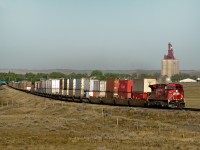 An eastbound intermodal curves out of Maple Creek on its run between Medicine Hat and Swift Current.