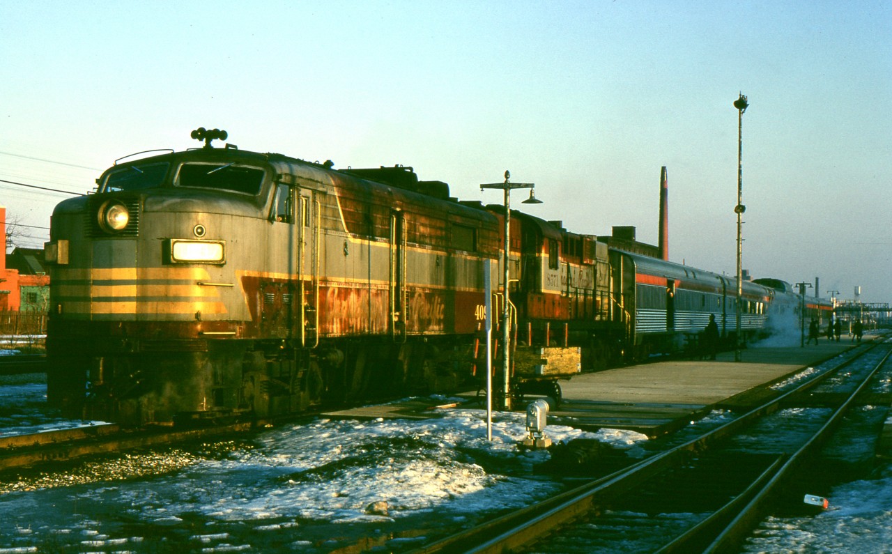 Some of the polish of earlier years seems to be lost as the northbound Canadian makes it's station stop at West Toronto. FPA-2 4097 and RS-10s 8571 with 5 cars make up #11 this March 12, 1972.