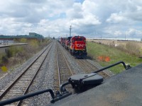 CN 382 lead by CN 2130, former UP 9095 nee CNW 8547 drifts downgrade from Brampton into Halwest on CN's Halton Subdivision on its journey from  the USA to Mac Yard.