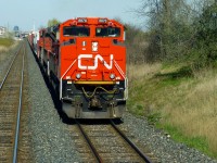 A very clean CN SD70M-2 8878 is in charge of this very large M399 as it passes through Norval,Ont on a warm sunny afternoon. CN 523 passes 399 after setting out 9,424ft of traffic at Aldershot.

With the demise of CN trains 330/331, some trains are now much larger and will be operating with DP power as required. May 7/16 both 421 and 385 were DP powered trains. 421 was almost 16,000 tons and over 11,000ft out of Mac Yard. 