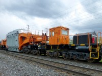 And I thought my locomotives were huge. CN train 435 passes train L350 at Brampton,Ont. L350 was a special move for Hydro One. Because if L350's D9 status, the train must come to a stop if it to be passed by any other non dimensional train. The opposing train must move at 10 mph until clear of L350. The train started out in Hamilton,Ont and was forwarded to the CP Rail interchange at Oshawa, Ont. Tomorrow the CP will pick it up and move it to a location near Oshawa, where it will be offloaded to a low-boy trailer for movement to a Hydro One facility near by.

The Schnabel car was built in 1974 by National Steel Car in Hamilton and was rebuilt in 2014. 

