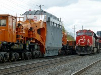  And I thought my locomotives were huge. CN train 435 passes train L350 at Brampton,Ont. L350 was a special move for Hydro One. Because if L350's D9 status, the train must come to a stop if it to be passed by any other non dimensional train. The opposing train must move at 10 mph until clear of L350. The train started out in Hamilton,Ont and was forwarded to the CP Rail interchange at Oshawa, Ont. Tomorrow the CP will pick it up and move it to a location near Oshawa, where it will be offloaded to a low-boy trailer for movement to a Hydro One facility near by. The Schnabel car was built in 1974 by National Steel Car in Hamilton and was rebuilt in 2014 
