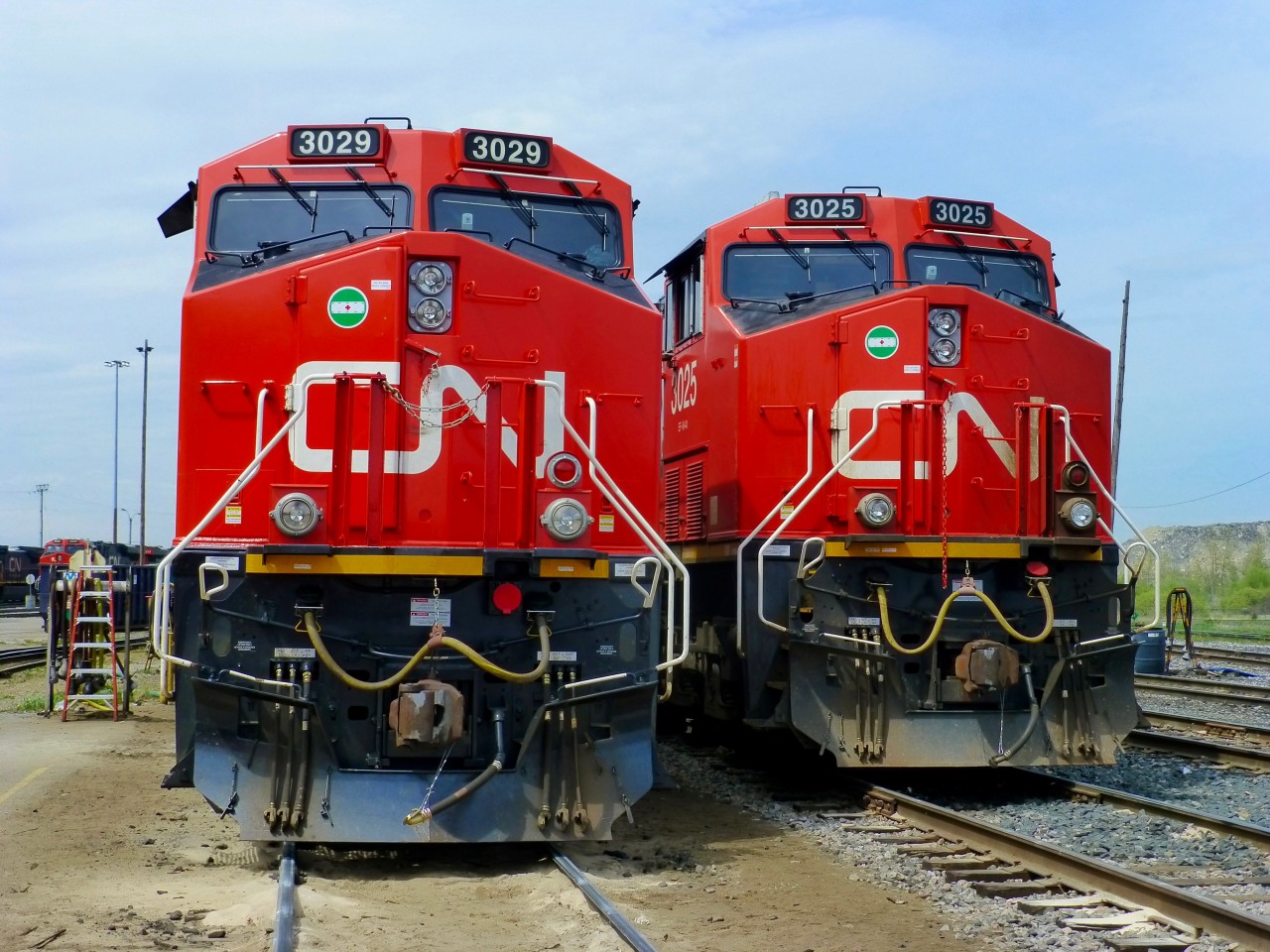 You can smell the new paint! Brand new CN ET44AC's 3029 and 3025 sit on the outbound shop track at Mac Yard being prepped for their next asignment. AC is now the dominant power on CN trains, with 90 more on order.