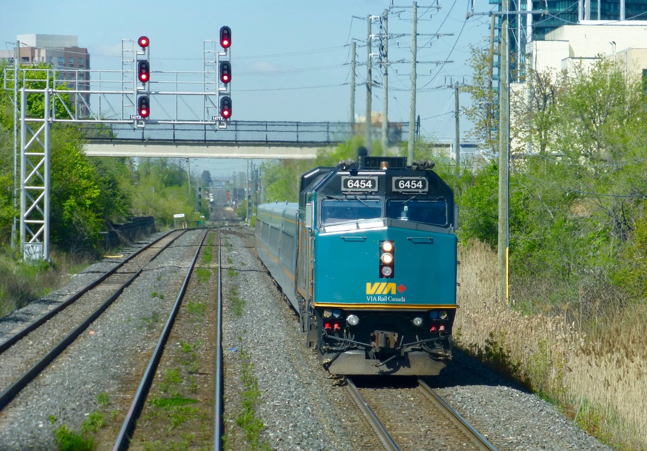 VIA #84 lead by F40PH-2d 6454 has just left Brampton VIA/GO station as it moves by Peel on CN's Halton Sub on its way to Toronto Union Station.