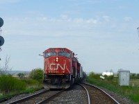 CN 523's crew gives a big wave to the test train crew doing an inspection at Ash on CN's Halton Sub. Since the demise 330/331 from Sarnia to Pt. Robinson there seems to be a big increase in traffic between Pt Rob and Mac Yrd. 523 ran 4 days in a row from Mac Yrd to Aldershot and back  and there have been 524's from Pt Rob to either Aldershot or as in todays case, right to Mac Yrd. This is addition to the regular 421/422 trains. 