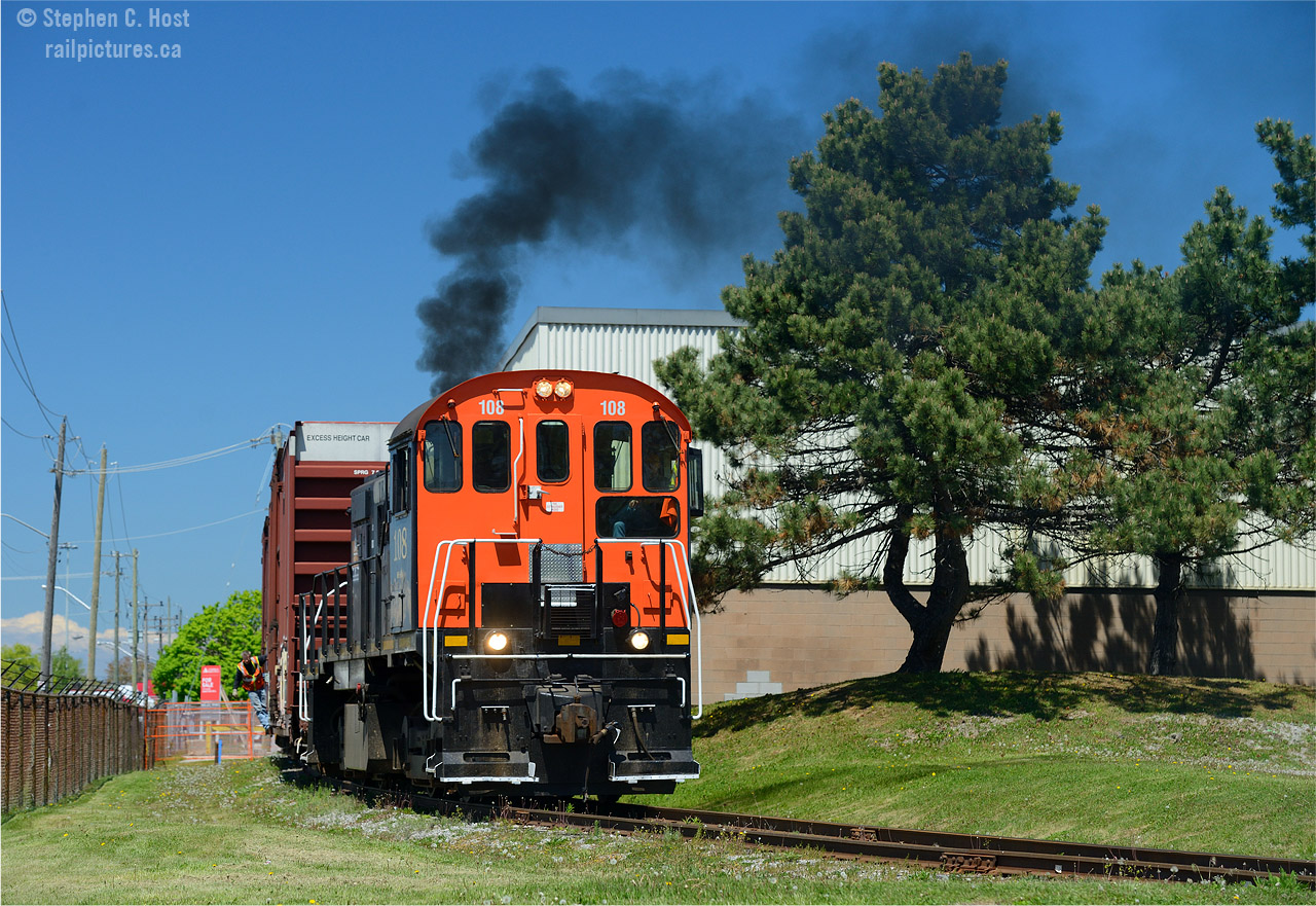 And the reason you photograph MLW's? Smoke... plenty of it! Trry 108 chugs in a typical MLW groan while the crew lift 2 boxcars from WP Warebousing in St. Catharines.
Some folks have mentioned the former Interlake paper plant - which I've shot but never with a train - where are their boxcars going for transload? Is this warehousing company involved? See the other two previous shots in this series by clicking on 'more' beside my name. Photo notes: Most photos in this series employed use of a polarizer filter.