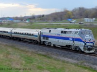 Zooming by the 403, VIA 98 is wasting no time to get to Aldershot for a station stop.<br><br> Photo notes: 

When the light isn't in your favour.... make something with it - I'm shooting at a spot that would be backlit in the mid to late afternoon, the clouds are non existent behind me (thus too bright to shoot facing south with such a bright sky) and the clouds to the north west made for a perfect way to mash everything into the histogram of my camera's sensor. I opted to pan this shot given the light at hand being somewhat low, easier to force my camera to a low shutter speed. 

