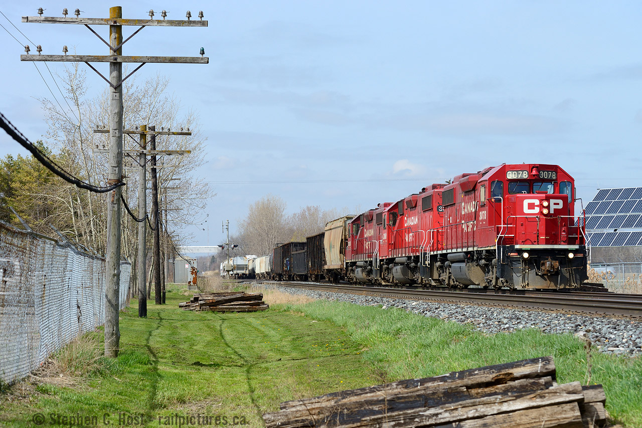 T69 goes about their business switching in the backtrack at Zorra siding. Moment later is when a farmer would rip off the crossing gate.