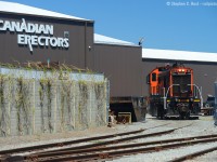 Canadian manufacturing is dead? Nope - tell that to Canadian Erectors - who had a load of formed steel products to come out of their Eastchester Ave plant. 108 is reversing to go inside the plant to lift a bulkhead. Note the switchback used, a very interesting track layout for sure. Not sure why the switch back even exists, you'd think the spur could just go in direct using the right of way as shown..<br><Br> The lakeshore spur was recently (3-4 years?) cut back to about this point, formerly having ran under the QEW to customers on the north side of the highway. 