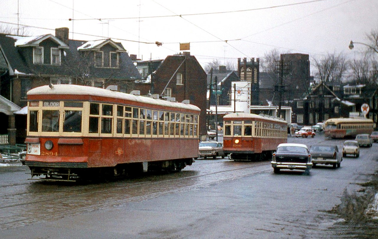 TTC Peter Witt cars 2894 and 2300, two of the three Witts out on the UCRS charter this winter day, head west on College Street just west of Lansdowne Avenue, heading for Dundas Street. A PCC in regular service can be seen by the Texaco gas station in the background.
