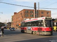 Dodging shadows with cars and cyclists, TTC CLRV 4157 heads south on Bathurst Street at Wellington on a 511 run, after diverting back onto Bathurst at Adelaide due to road construction between Dundas and Richmond.