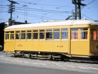 Toronto Transit Commission rail grinder W-27 is pictured at the intersection of College and Lansdowne in October of 1960. This Preston Car and Coach Company 1915-built single truck two axle car was formerly Toronto Civic Railways streetcar 53, before being converted into a snow scraper car and then rail grinder W-27 to serve on the streetcar network. It was later transferred to subway service and became rail grinder RT-7, and was eventually donated to the HCRY (where it joined two other TCR cars that had also become work cars).
