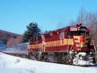 Train 3 the ASNOW heads north with WC 6596 and 7551 leading 13 cars near Bellevue ONT.  The FP9's started to have trouble keeping up with passenger duties in the late 90's and numerous freight units started to fill in some cases. 