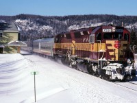 The Snow train passes Searchmont station in a cloud of snow dust in February 1999 with 7551 and 6596 leading. By 1999 Freight units often handled the winter Snow train as the F's were often away in Gladstone-Sault Ste. Marie freight service and the power laying over during the day from the freights north of Steelton was readily available to run up to Canyon and return, then be serviced and still leave on northbound freight 11 near midnight.