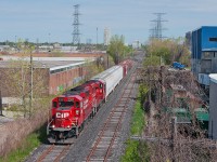 An extra yard assignment out of Agincourt trundles down the former Canadian Pacific Canpa Sub, now owned by Metrolinx (GO Transit). Behind the pair of GP20C-ECO's is three plastic cars for one or maybe two customers, Polytainers at Area H or Hymopak at Area I and five clay hoppers for Versapet. Versapet used to be serviced by CN Rail not that long ago on the Uxbridge Sub but moved to a bigger facility along the Canpa after being told off by management about wanting regular service. Talk about customer service, eh ?     