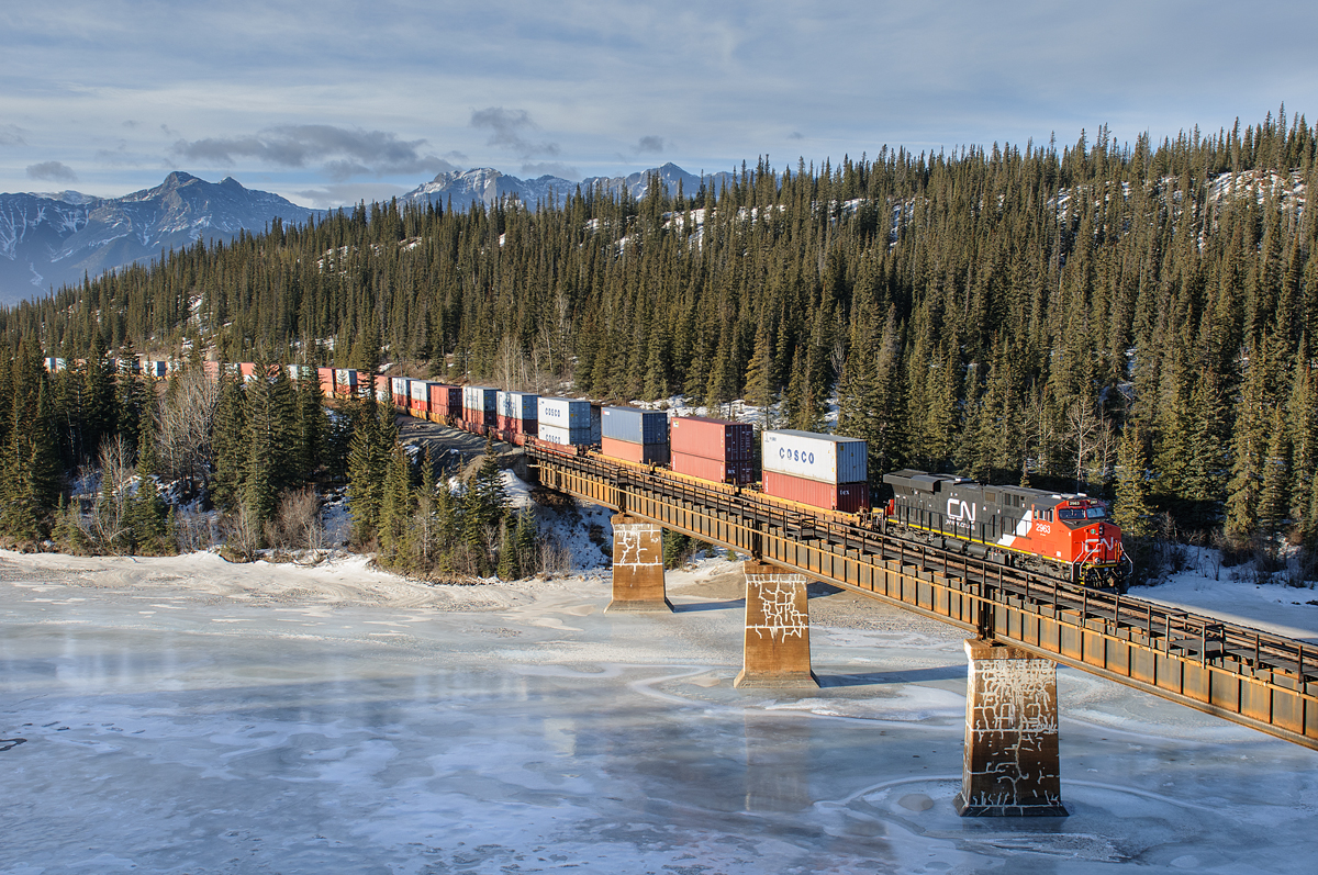 Prince George based CN ES44AC 2963 leads Q196's train out of The Rockies and over the Athabasca River between Entrance and Solomon on CN's Edson Sub.
