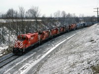 With no shortage of power CP 508 drifts down hill east bound around the curves at Audley ( Ajax ) Today's consist 1848 1824 1815 1805 4229 and 4709. The last two units on idle . 